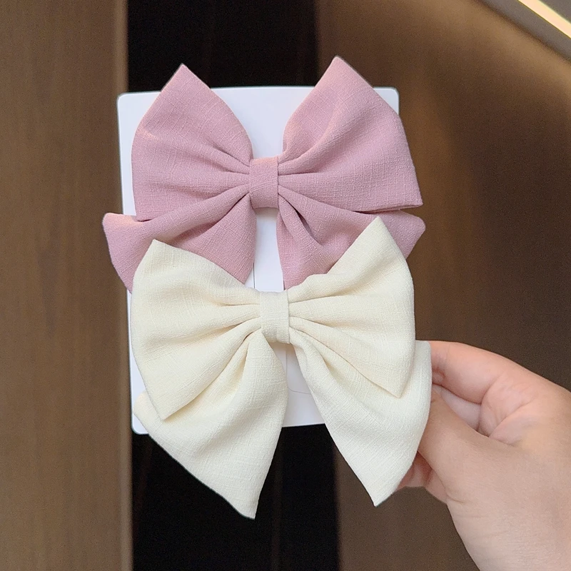 Nœuds de cheveux de couleur unie, 2 pièces/lot, Boutique avec Clips pour filles, nouveaux couvre-chef, accessoires pour cheveux de bébé, cadeau, pinces à cheveux pour bébé