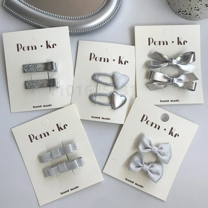 Pinces à cheveux avec nœud en cuir argenté pour enfants, couvre-chef coréen pour filles douces, épingles à cheveux en forme de cœur scintillant, accessoires pour cheveux en tissu pour bébé, nouvelle collection 2024